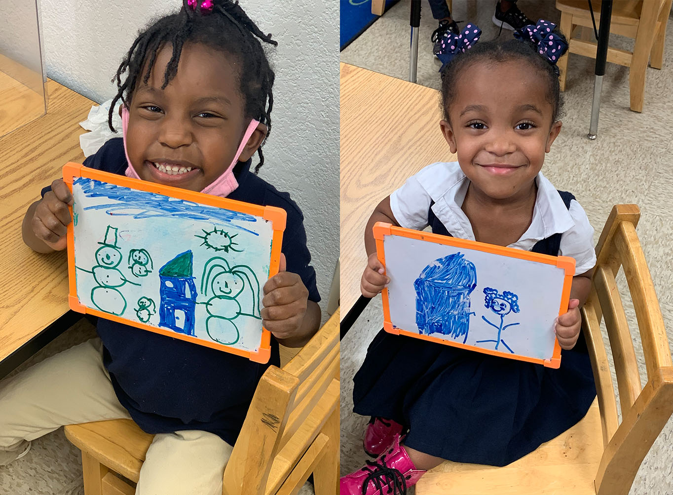 Happy Preschool children holding pictures