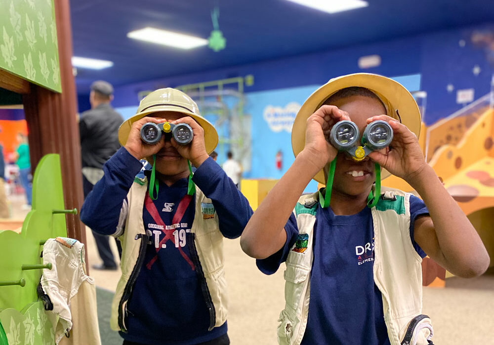 kids looking through binoculars